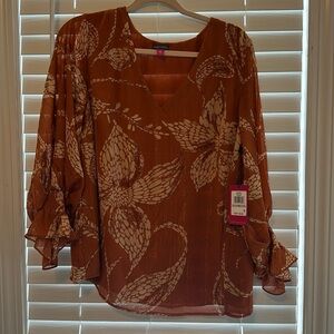 Burnt orange blouse with gold detail